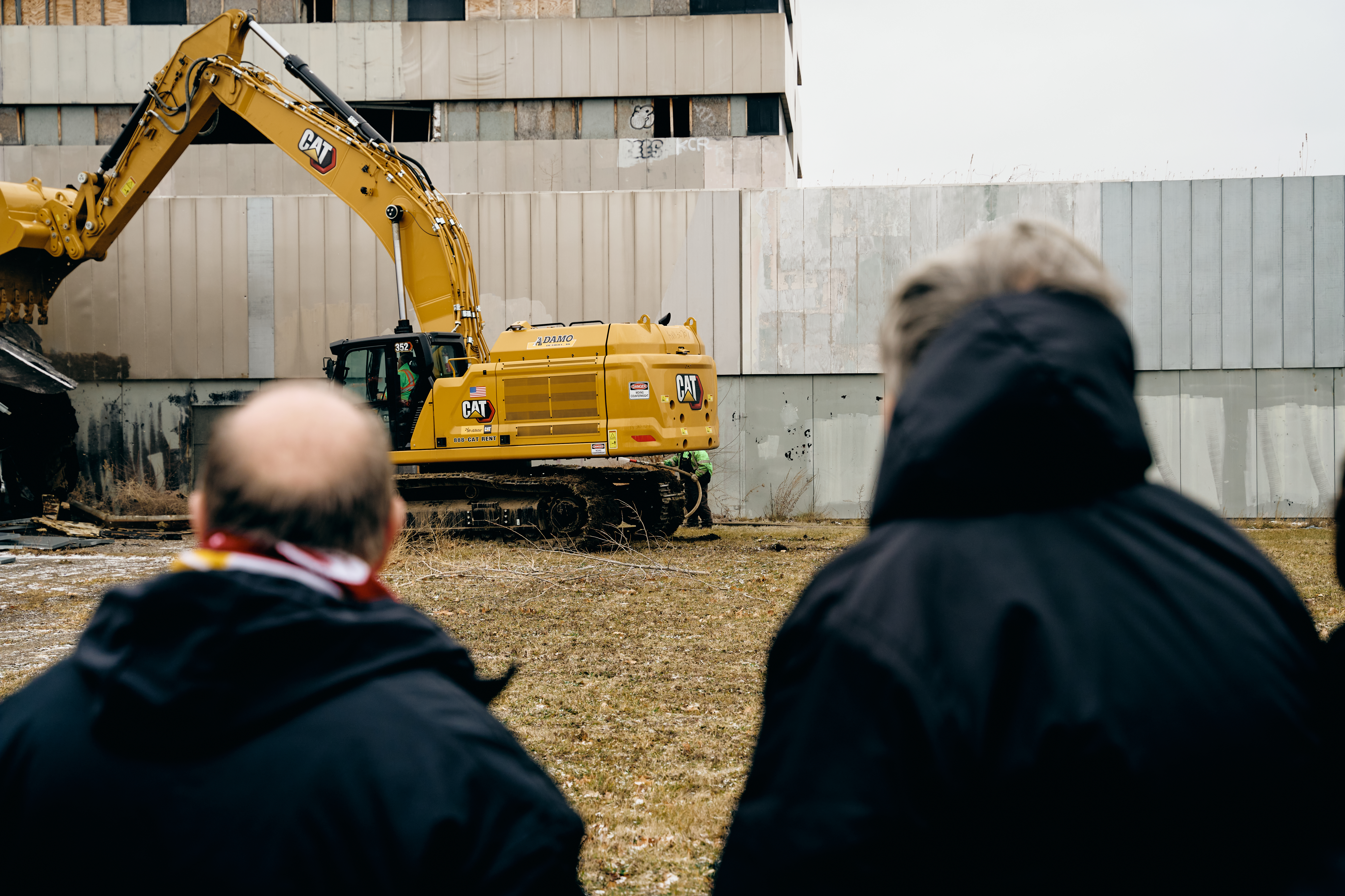 DCFC CEO Sean Mann and Mayor Mike Duggan look on as demolition begins on future site of AlumniFi Field