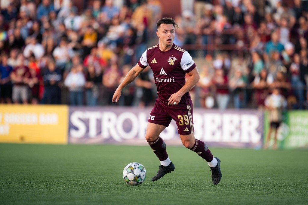 Ryan Williams controls the ball for Detroit City FC