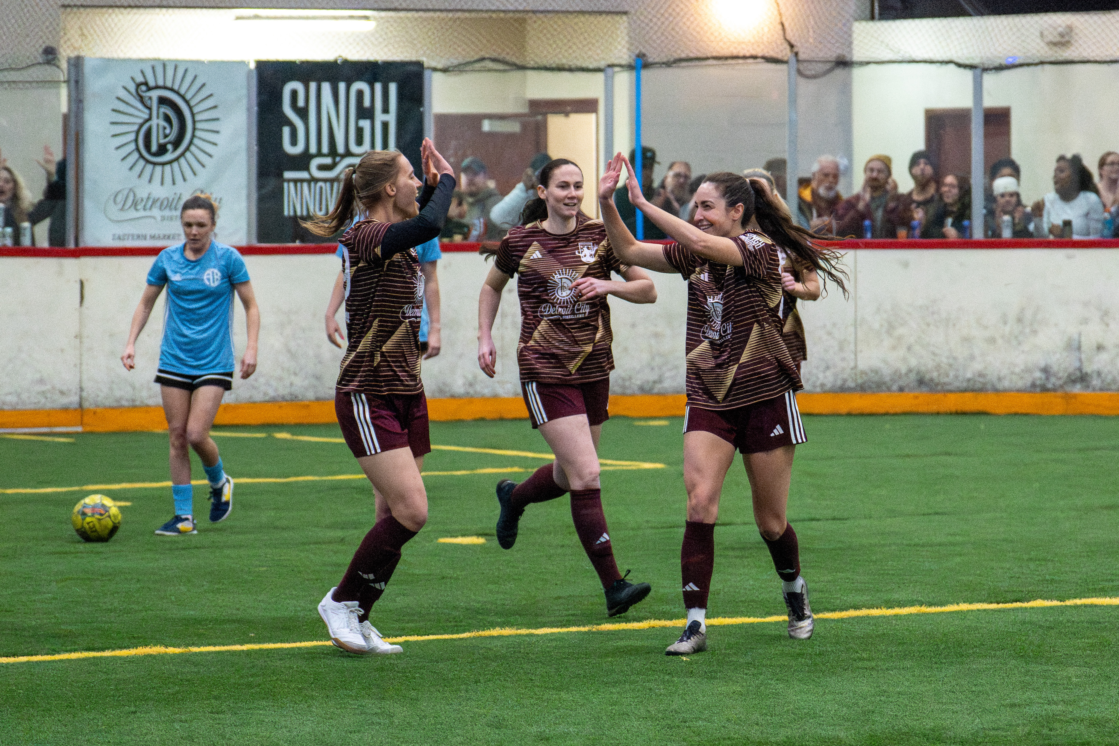 Detroit City FC women's arena team celebrates goal in victory over FC Berlin