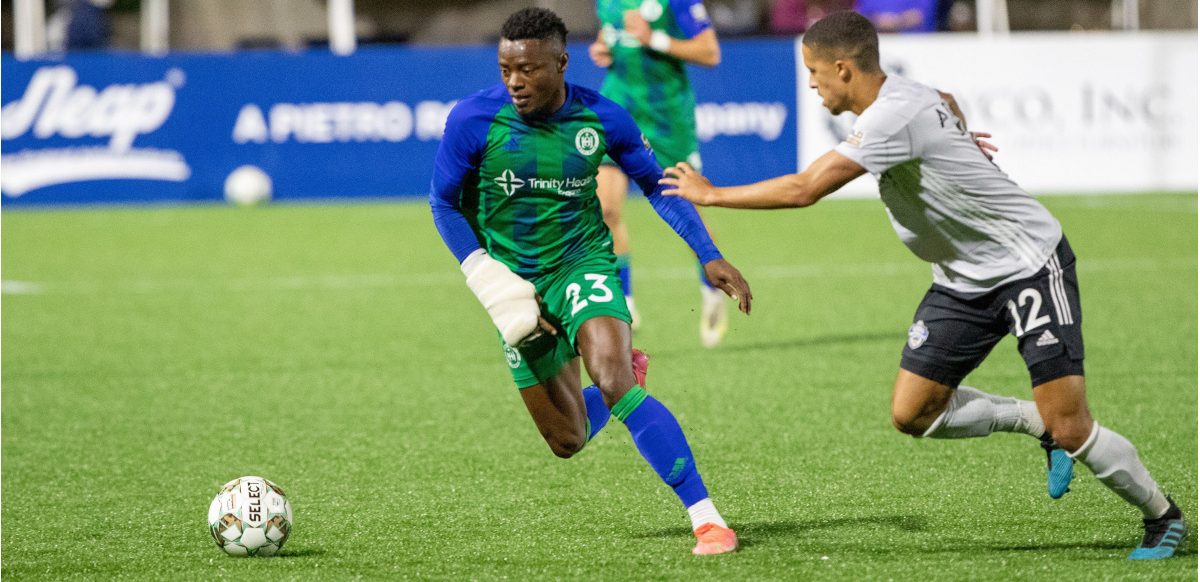 Preston Tabort Etaka controls the ball