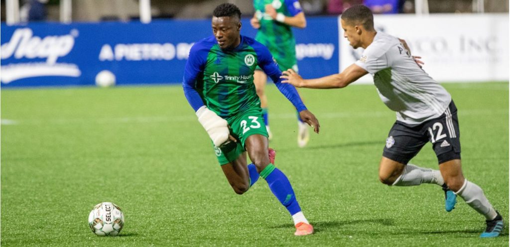 Preston Tabort Etaka controls the ball