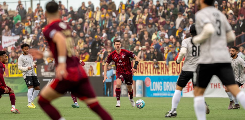 Callum Montgomery controls the ball