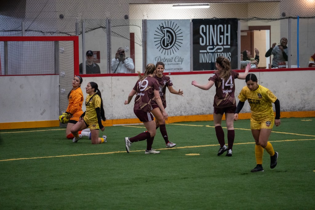 DCFC players celebrate after a goal in the semifinal round