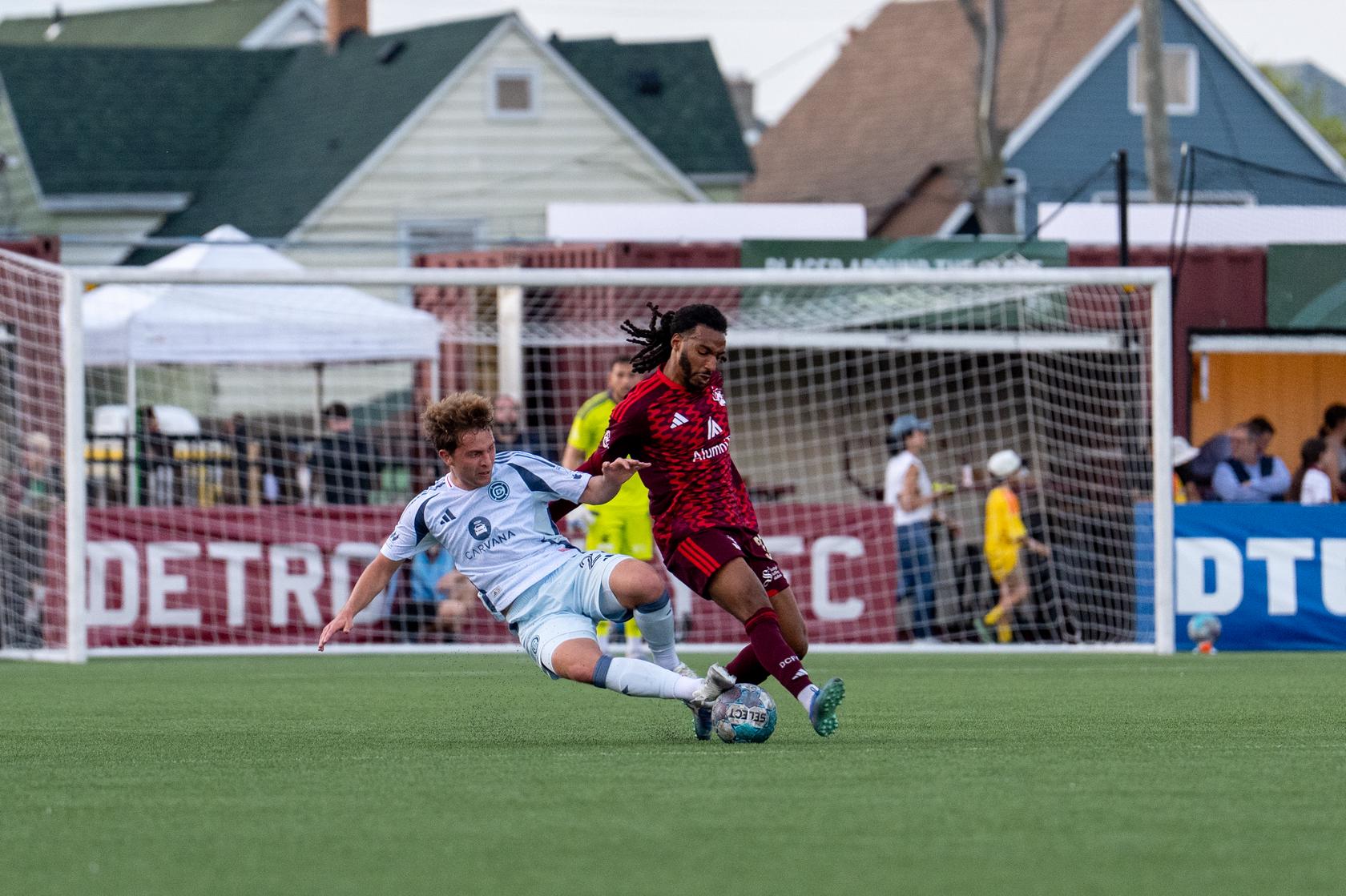 Devon Amoo-Mensah battles for the ball