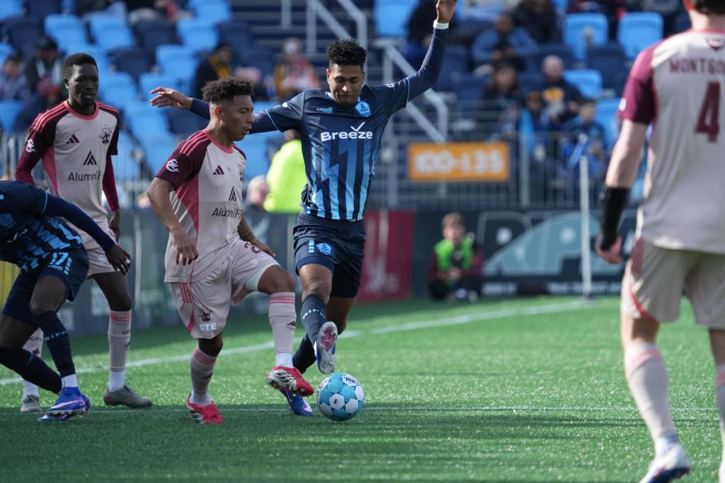 Kobe Hernandez-Foster keeps the ball through traffic