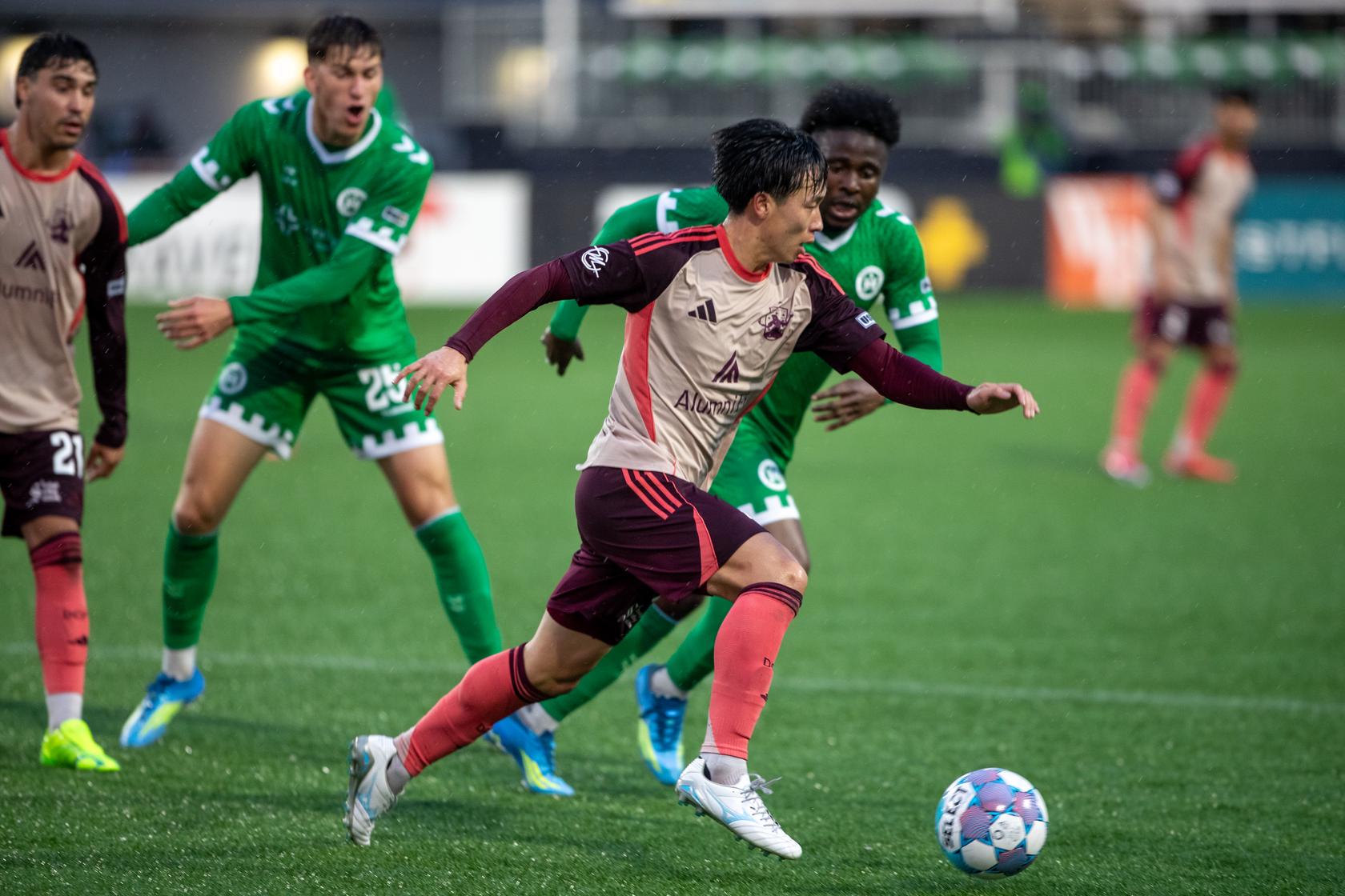 Haruki Yamazaki controls the ball