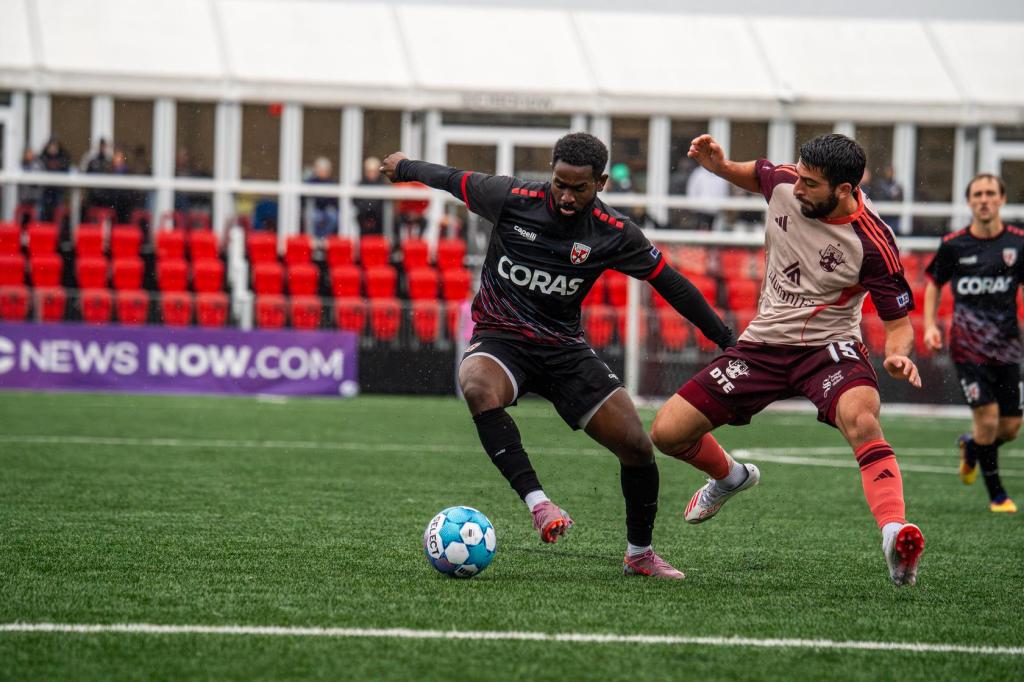 Alex Dalou battles for possession against Loudoun United